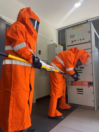 Participants undertaking high voltage training at AMC
