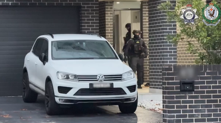 Police raid a property in Holsworthy before making an arrest: Image: AFP/MAST