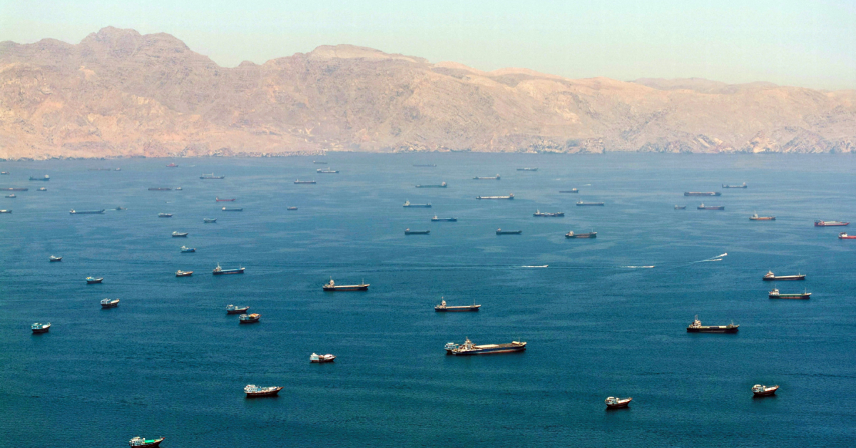 A drone view shows vessels anchored in the Strait of Hormuz as seen from Musandam, Oman. Image: mytaj1 / Shutterstock