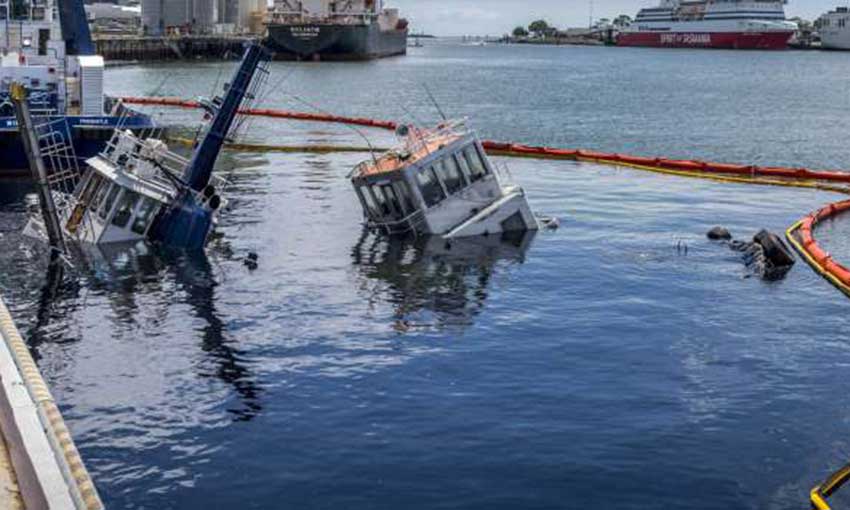 Barge deployed to salvage tug wrecks delayed by weather again
