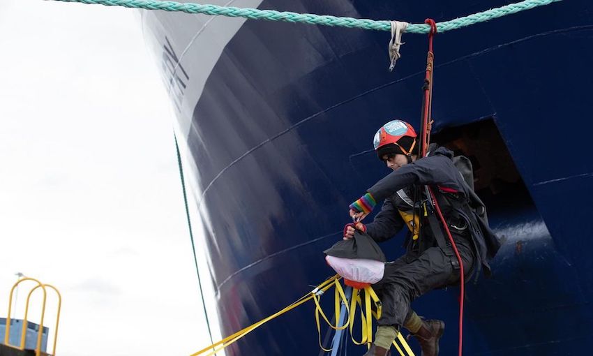 Protester climbs mooring line at Port of Hobart