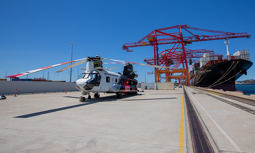Firefighting helicopter arrives, takes off from Port Botany